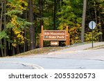 Rib Mountain State Park sign pointing to Park Road headed for Granite Peak ski area in Wausau, Wisconsin, horizontal