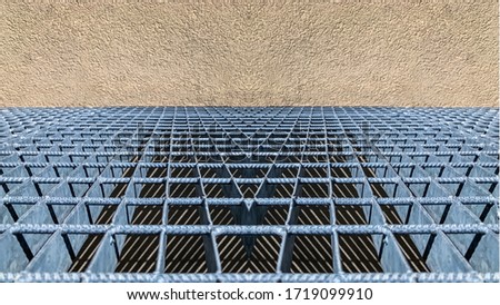ribbed protective welded metal mesh of reinforcing bars.