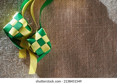 Ribbon Ketupat On The Jute Texture Background