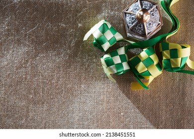 Ribbon Ketupat On The Jute Texture Background