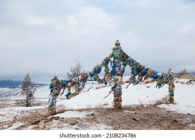 Сolumns With Ribbons On Lake Baikal With Mountains In The Background