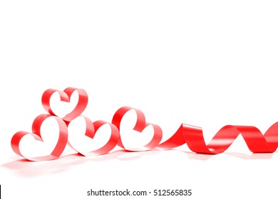 Ribbons shaped as hearts on white, valentines day concept - Shutterstock ID 512565835