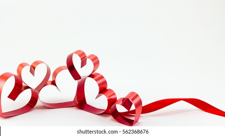 Ribbons shaped as hearts on white background, valentine day concept, happy valentine. - Shutterstock ID 562368676