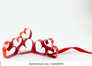 Ribbons shaped as hearts on white background, valentine day concept, happy valentine. - Shutterstock ID 563469592