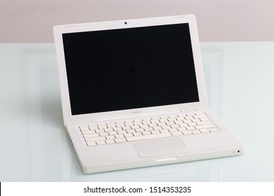 Ribeirao Preto, Sao Paulo / Brazil - August, 26, 2019: Old Macbook White, Year 2009 On A Glass Table