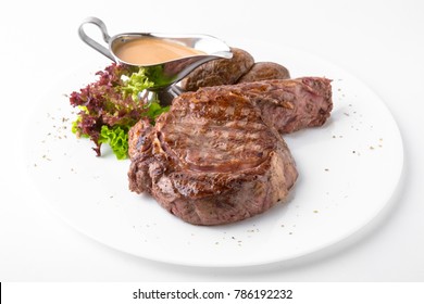 Ribeye Steak On The Bone 
With Baked Potatoes And Mustard Sauce. Restaurant Menu. White Background.