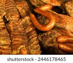 Ribs, and beef brisket grilling in an open pit BBQ grill in Texas BBQ style, Houston, Texas, United States of America, North America