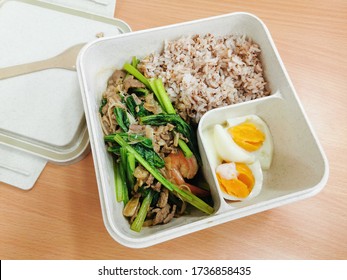 Rice box :Vegetable fried rice and Boiled eggs,luchbox wiht healty meal top view. Delicious food for luch.Healthy concept.selective focus. - Shutterstock ID 1736858435