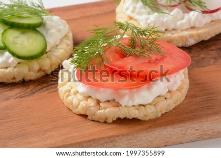 Rice bread Crispy bred Radish slices, tomatoes and cucumber  slices ,Cottage cheese and fresh dill 