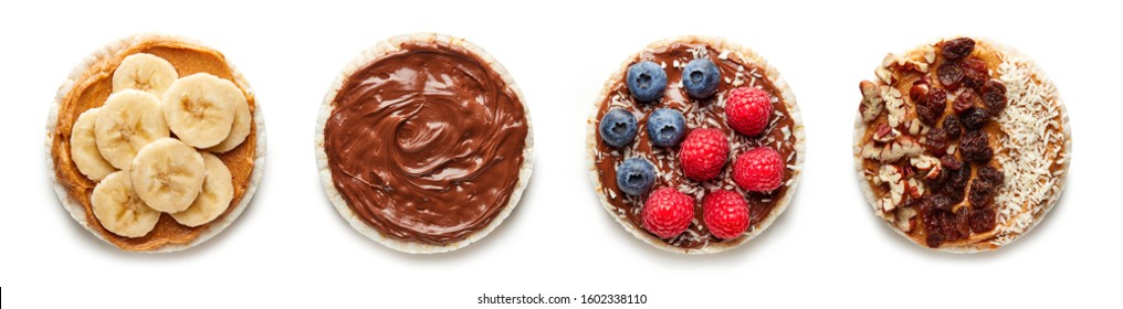 Rice Cakes With Chocolate, Berries, Banana And Nuts Top View Isolated On White Background