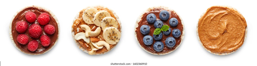 Rice Cakes With Nuts, Banana, Peanut Butter, Berries Top View Isolated On White Background