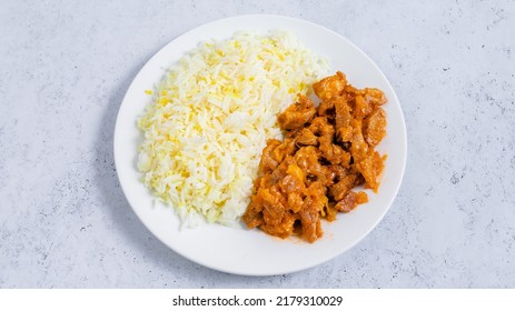 Rice With Chicken Goulash In Plate Isolated