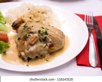 Rice And Chicken On White Plate