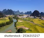 rice fields, Guilin, Pingle, mountain, hills, landscape. harvest, village life, countryside, south China, Asia, peace, peachful life, aerial view, drone, summer, blue sky, bird view，中国广西桂林平乐稻田
