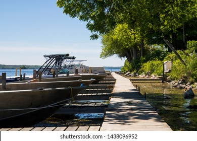 Rice Lake, Ontario, Canada With Wooden Dock And Boats