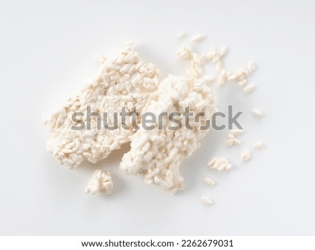 Rice malt placed against a white background. Koji mold. Koji is fermented rice. A view from directly above.