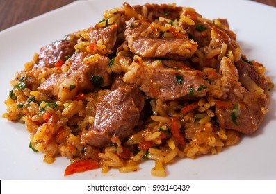 Rice with meat and vegetables in a plate