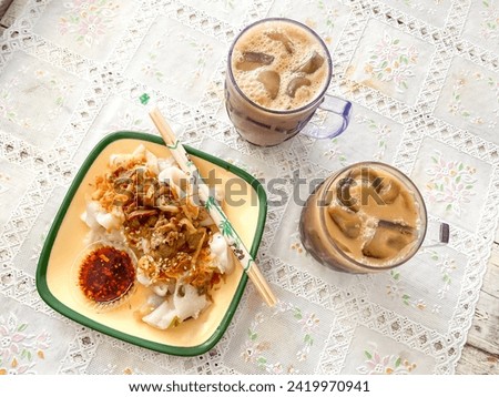 A rice noodle roll and cold chocolate drinks, also known as a steamed rice roll and cheung fun. Ci Cong Fan. Eating steamed chinese dumpling dim sum. Authentic typical chinese food.