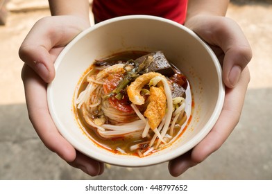 Rice noodles with spicy pork sauce (Nam ngiao) is a noodle soup or curry of the cuisine of the Tai Yai people. Nam ngiao has a characteristic spicy and tangy flavor. thai food.