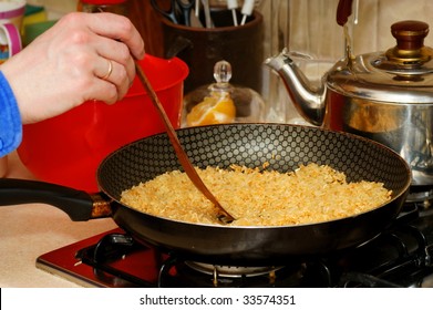 Rice On Frying Pan, Skillet, Wood Spoon