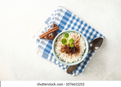 Rice Porridge With Cinnamon In A Bowl On A Light Concrete Background. Top View