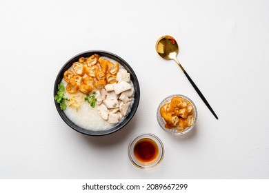 Rice Porridge With Fish Isolated On White Background With Negative Space.