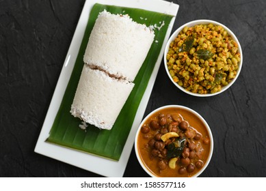 Rice Puttu With Kadala And Green Gram Curry, Pittu Popular Kerala Breakfast Food On Wooden Background Tamil Nadu South India. Top View Of Indian Veg Food Steamed Rice Cake.
