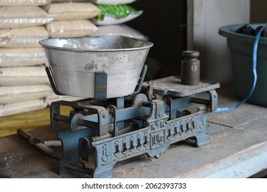 Rice Scale In Indonesian Traditional Market. Old Style Metal Scale.
