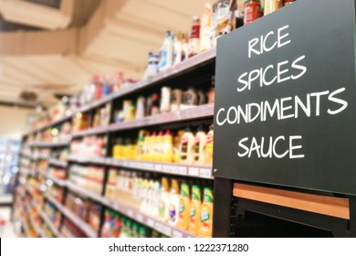 Rice, Spices, Condiments, Sauces Signage Grocery Categoy Aisle At Supermarket