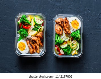 Rice, stewed vegetables, egg, teriyaki chicken - healthy balanced lunch box on a dark background, top view. Home food for office concept - Powered by Shutterstock