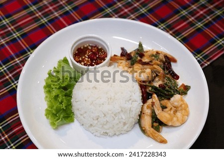 rice and stir-fried shrimps with Thai basil. Asian food style.