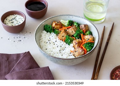 Rice with tofu, broccoli, carrots and sesame. Healthy eating. Vegetarian food