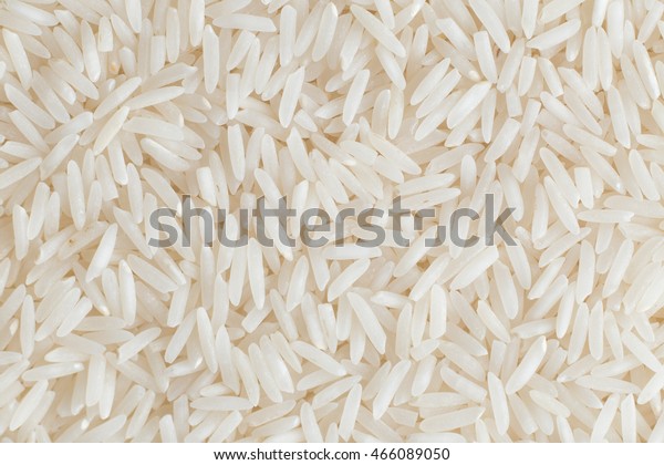 Rice,\
white grains closeup. Basmati. Unpolished, uncooked, natural, diet,\
raw for traditional asian cuisine, dish. Popular agriculture\
cereal. Texture pattern background, copy\
space.