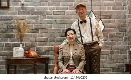 Rich Asian Senior Couple Vintage Fashion In Luxury Home