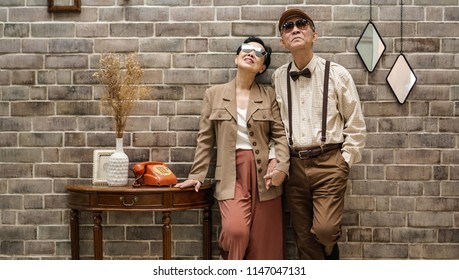 Rich Asian Senior Couple Vintage Fashion In Luxury Home