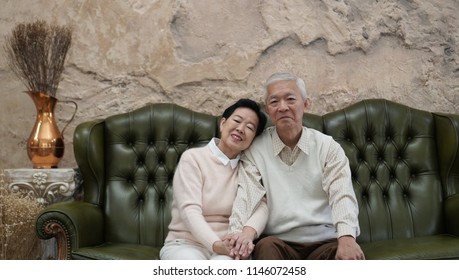 Rich Asian Senior Parents Sit In Luxury Beautiful House