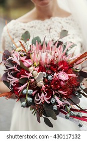 Rich Autumn Wedding  Bouquet Held By A Bride In Laces