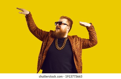 Rich Bearded Man In Leopard Print Outfit And Cool Glasses Vibing To Music. Happy Redhead Showman, Funny Party Guy, Showbiz Entertainer, Glamour Show Presenter, Night Club Goer Dancing And Having Fun