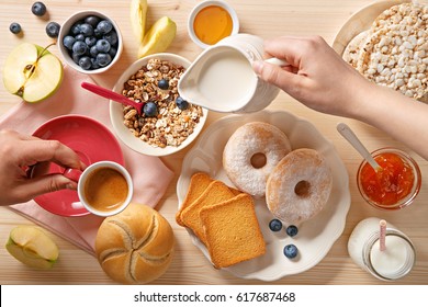 Rich Breakfast Table. Pouring Milk And Coffee. Top View