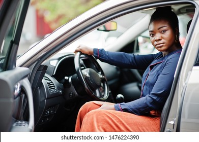 Rich Business African Woman Sit On Driver Seat At Silver Suv Car With Opened Door.