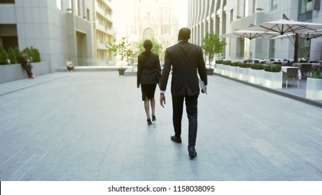 Rich Business Lady Walking Followed By Bodyguard, Successful Lady, Back View