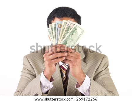 Rich businessman hiding behind american dollars