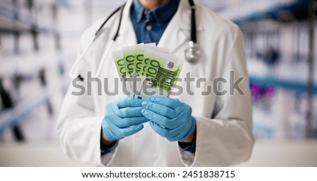 Similar – Image, Stock Photo Rich Doctor Man with Usd money. Handsome Medical Health Care Worker In White Coat with salary, payment. Jackpot, win
