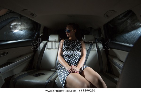 Rich, elegant,
beautiful woman in a
limousine