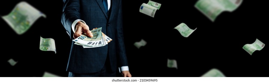 Rich man holding Europe money. Cash Euro bill flying banner. Euro money background - Shutterstock ID 2103459695