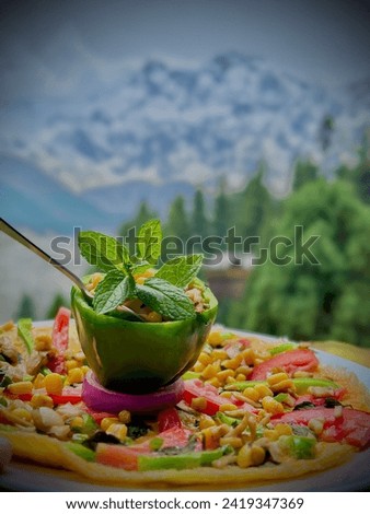 A rich omelette full of cones and vegetables right in front of Nanga parbat fairy meadows