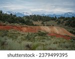 Rich Ore Mining Tailings Pile, Red Orange Dirt - Masonic Mountain Historic Mining Town, Snow Capped Sweetwater Mountain Landscape Background