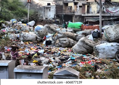 Rich Produce Debris - Poor Make Money On Rich. Garbage As Profession (picker). Collection Sorting And Selling Garbage. District Of Poverty (pockets Of Poverty) In India. Waste And Old Things