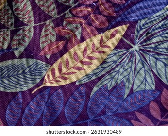 The rich purple background is adorned with an array of stylized leaves in various shapes and sizes.