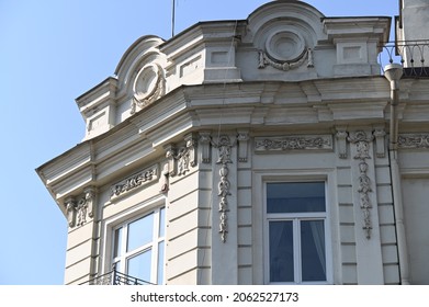 a richly decorated corner parapet of a historic building
